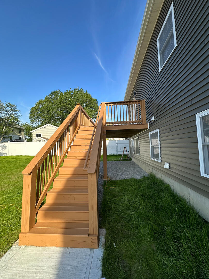 Untitled deck builders in Massachusetts work
